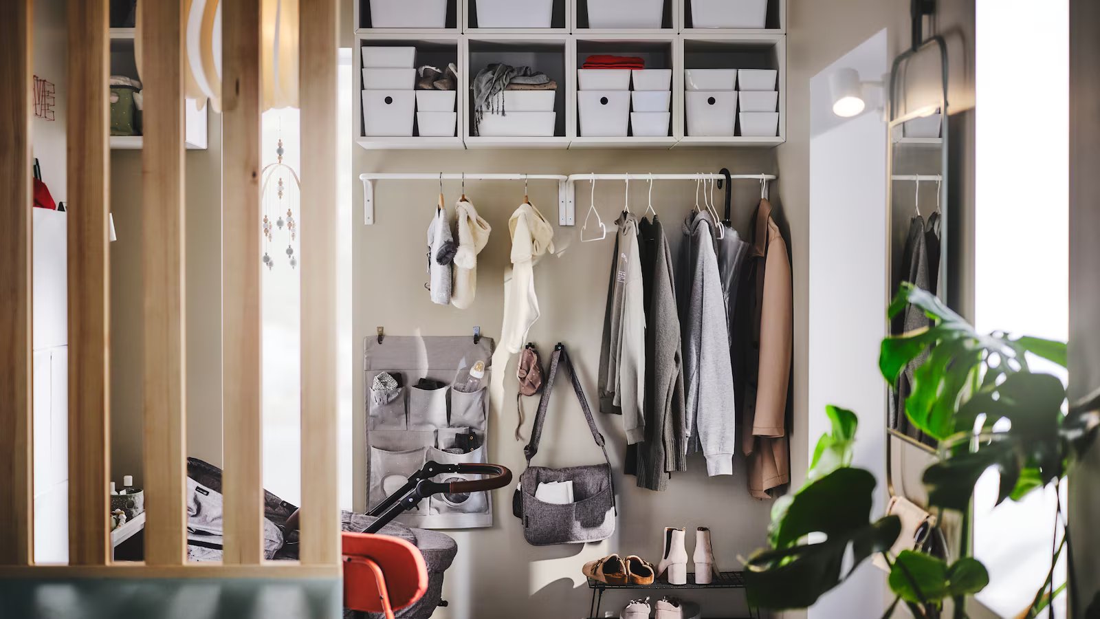 A small, contemporary hallway filled with family storage​