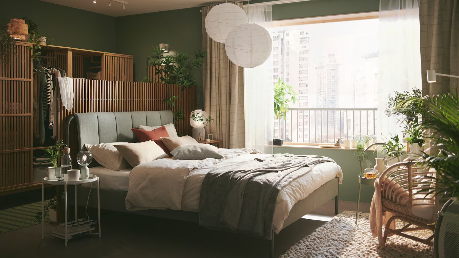 A serene and calm green bedroom that feels close to nature